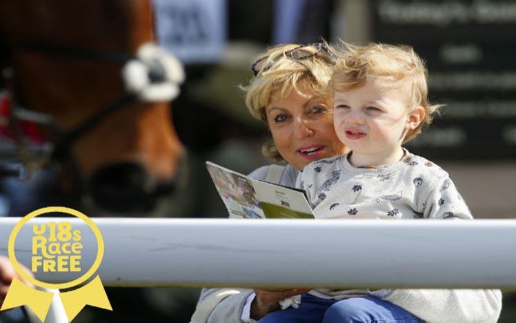 A mother and child enjoy a dasy racing